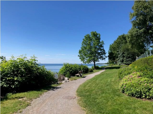 Author’s colour photograph of a lakeside pathway in Oakville, June 2024.